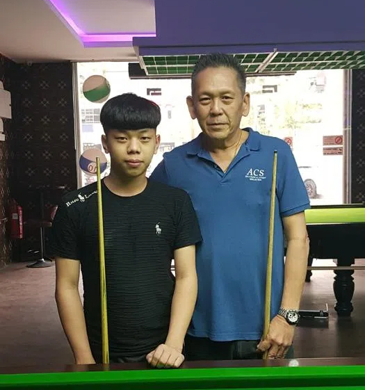 Player breaks a pyramid in billiards.